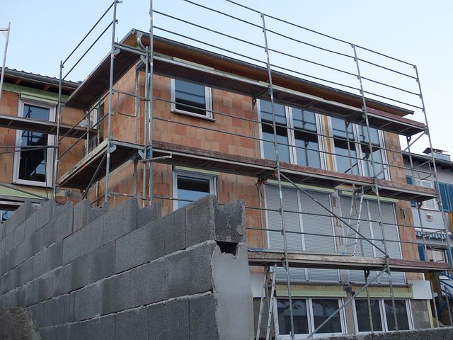 scaffold surrounding a home for construction